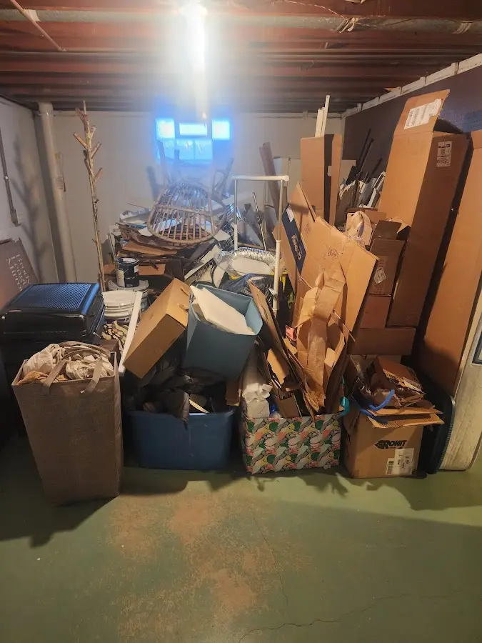 Roll-off dumpster container at job site for 2 Yard Dumpster Rental in Piqua